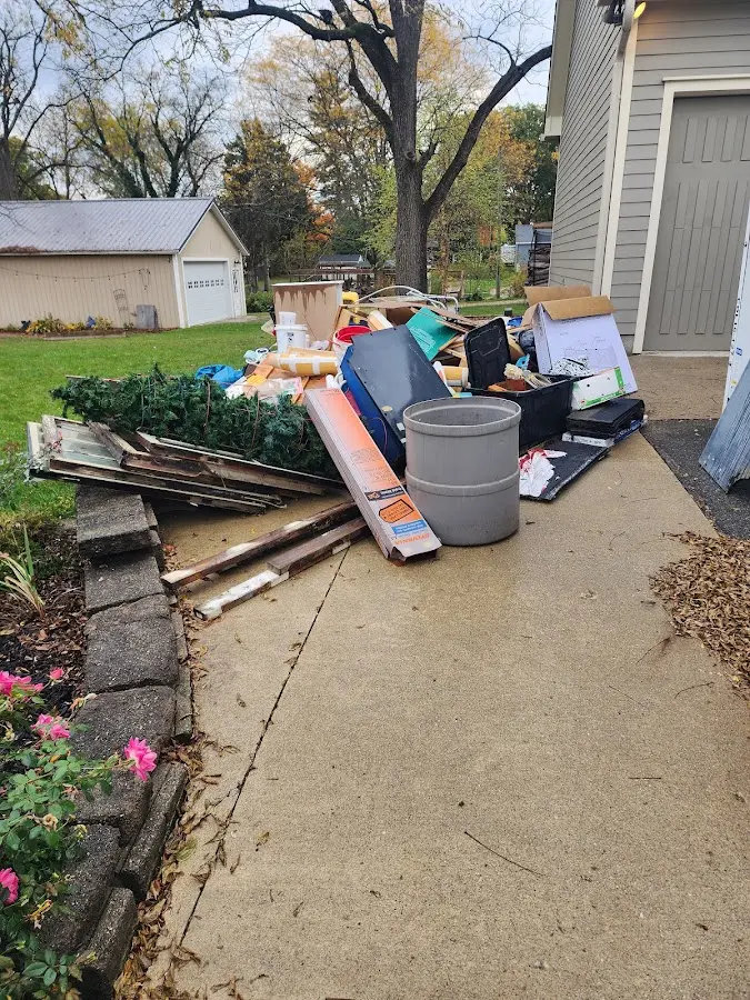 Dumpster being loaded with debris for Commercial Dumpster Rental in Ionia